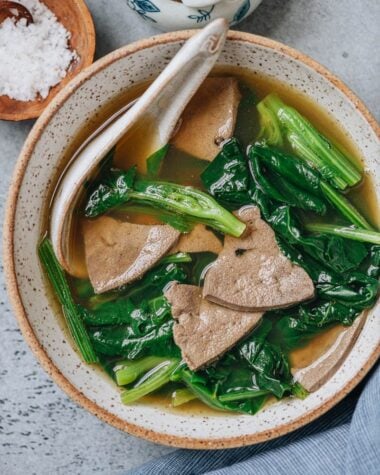 Pork liver soup with spinach close up
