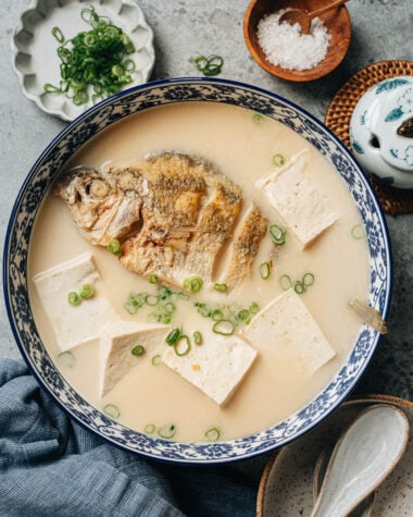 Chinese milky fish soup with whole fish and tofu in creamy white broth