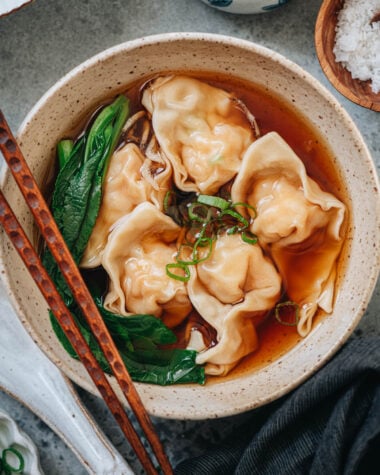 Bowl of shrimp wonton soup with wontons in clear broth